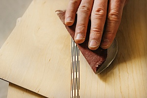 Hand sanding plywood 