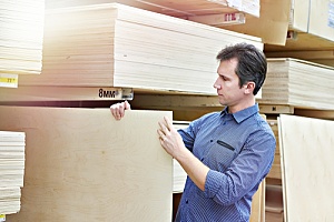 Man shopping for plywood 