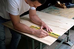 Man working with plywood