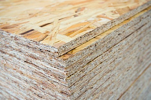 Pile of plywood stacked together