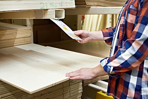 Man checking plywood price 
