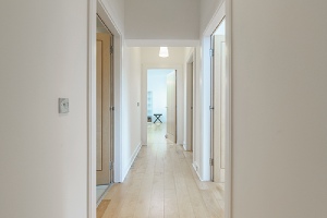 Bright hallway in an apartment.Many use fire-retardant wood for corridors and hallways construction.
