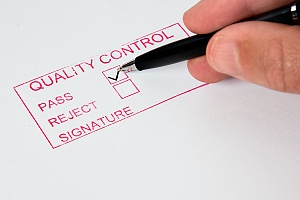 person filling out a quality control form for fire-retardant plywood