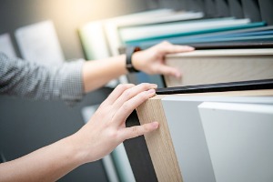 male-hand-choosing-cabinet-panel-or-countertops-materials-for-builtin-picture