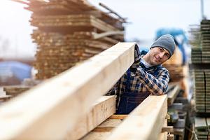 A worker helping customer pick the right green building materials