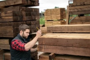 storeman checking lumber quality