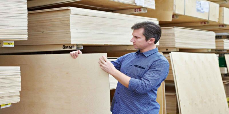 A wholesale plywood supplier checking stock